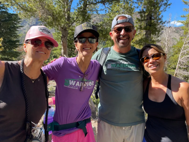 A group of hikers taking the Be Warrior Challenge on the Mount Rose Summit Trail 2023