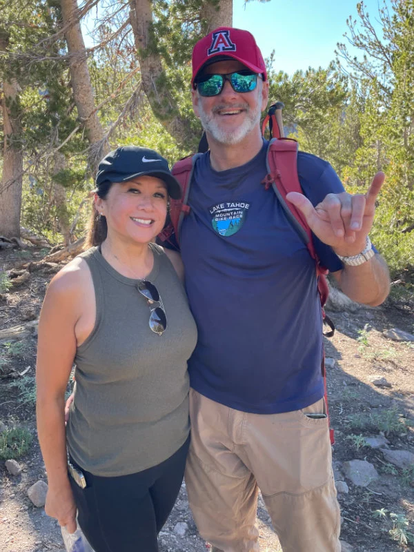 A man and woman hiking in the 2023 Be Warrior Challenge hike on Mount Rose