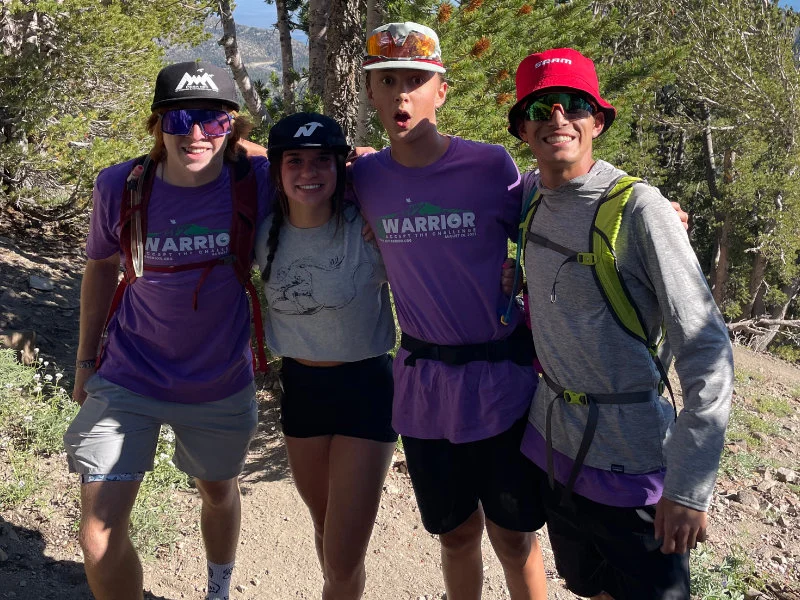 A group of teens hiking with Be Warrior Challenge at the 2023 hike on Mount Rose Summit Trail