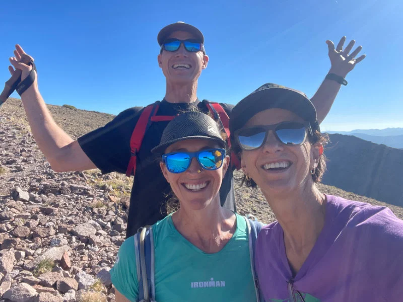 Three hikers at the Summit of Mount Rose for the 2023 Be Warrior Challenge Hike