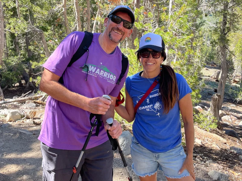 A man and woman hike together at the 2023 Be Warrior Challenge Hike